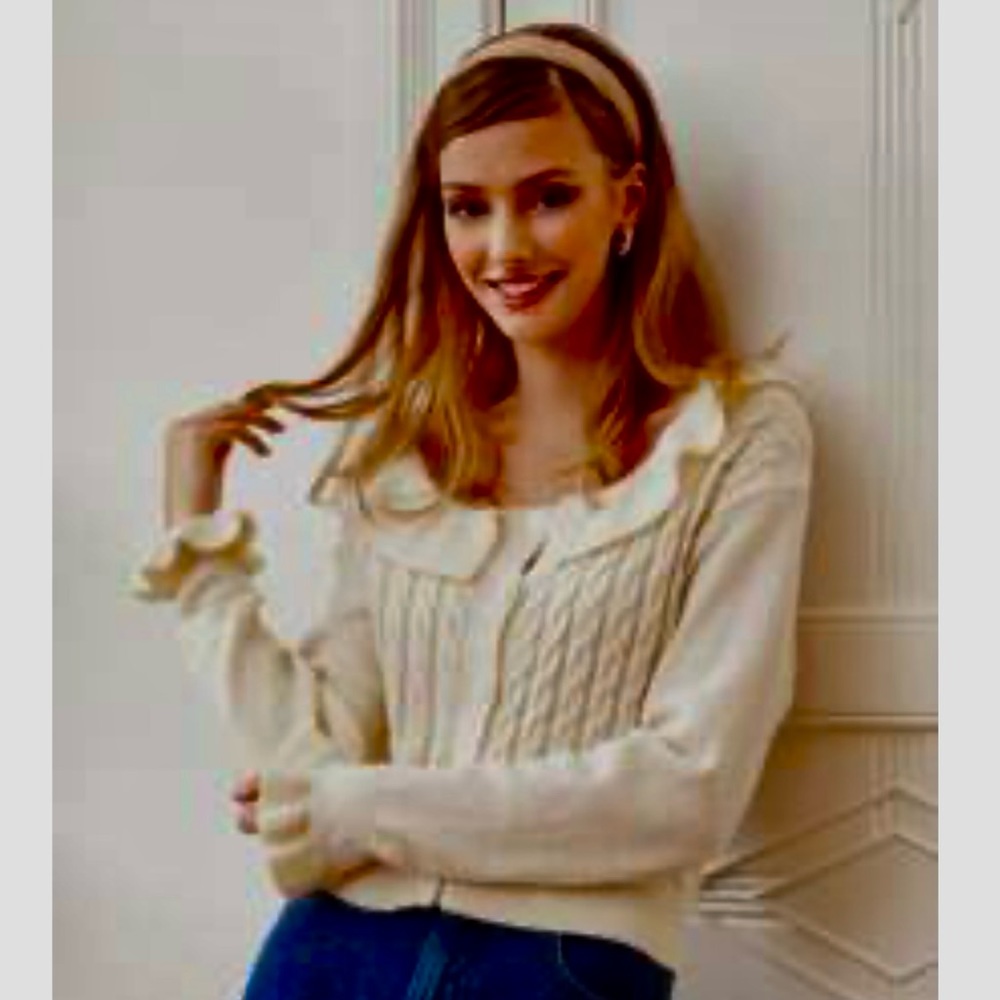 Ruffled cardigan style pullover with cables and fancy sleeves